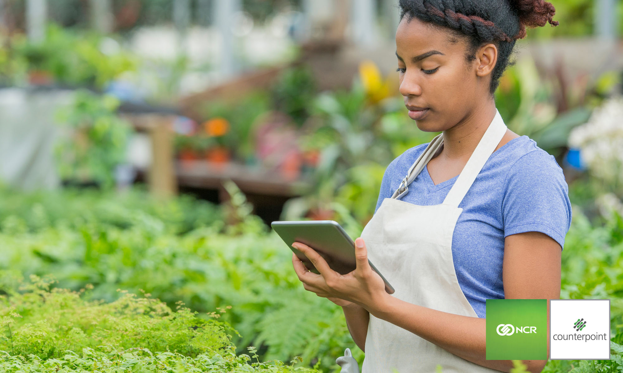 Woman standing in garden and nursery store